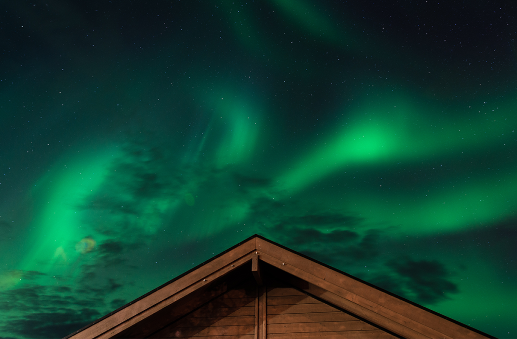 Norther lights above a cabin
